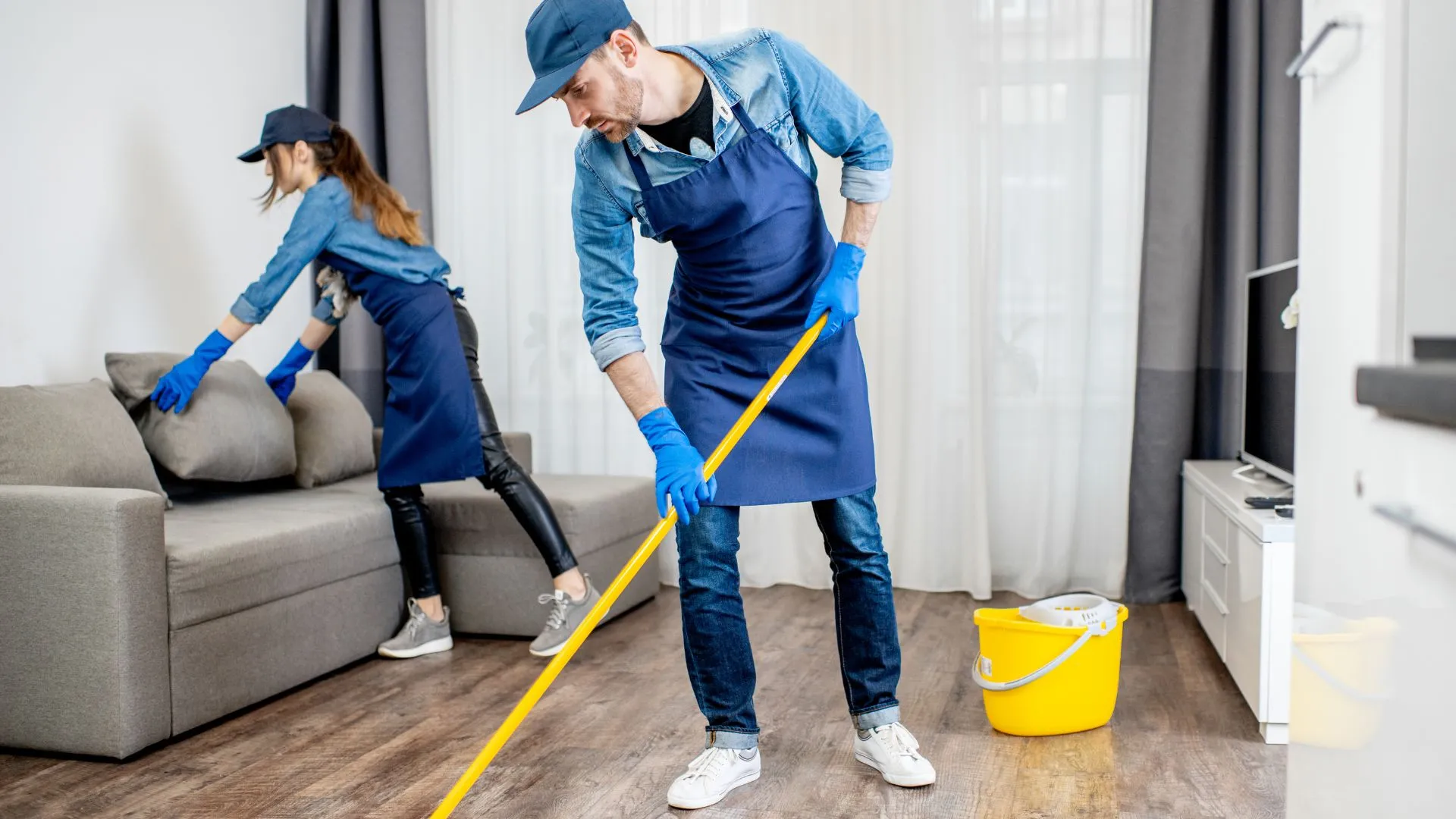 ICS housekeeping staff cleaning a retail mall floor