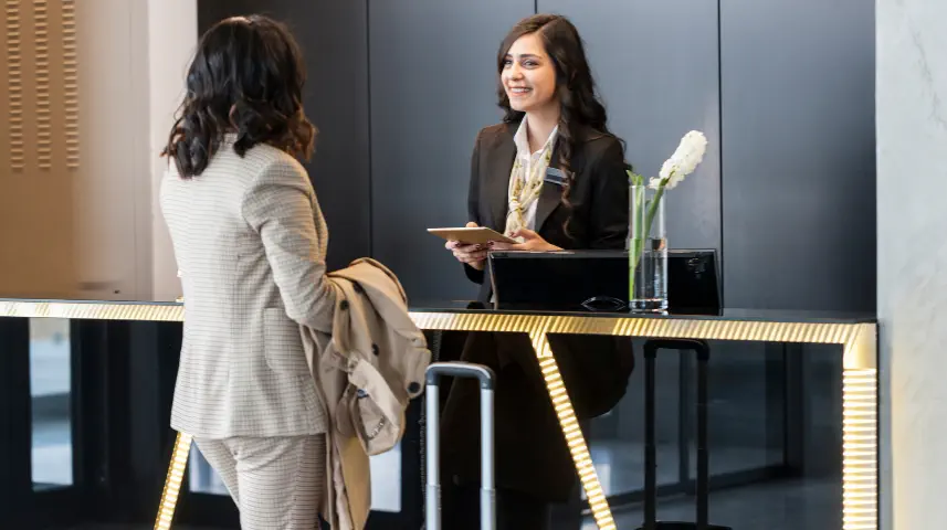 ICS front-desk team welcoming and registering a visitor